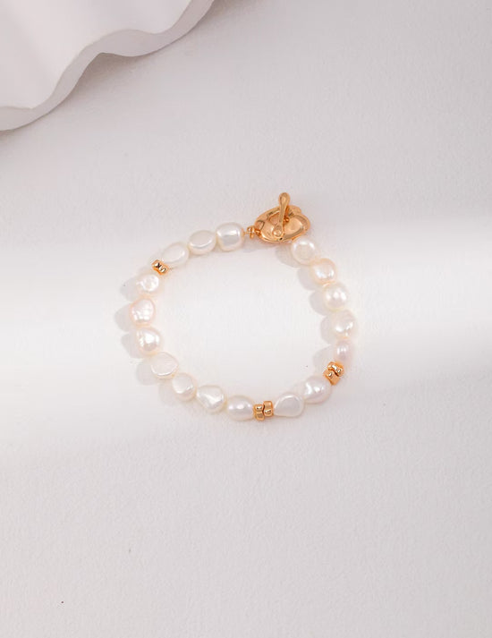 Simple sterling silver pearl bracelet with unique OT clasp design